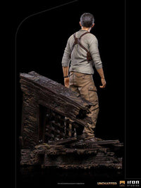 Back view of the 22cm Iron Studios Uncharted Nathan Drake statue standing on a detailed wooden shipwreck base.
