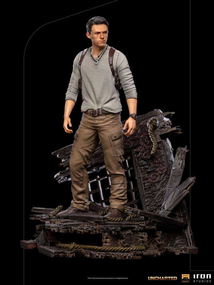 Iron Studios 1/10 Nathan Drake statue from the Uncharted movie, featuring a detailed figure on a shipwreck base.