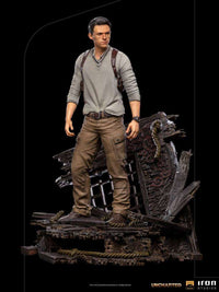 Iron Studios 1/10 Nathan Drake statue from the Uncharted movie, featuring a detailed figure on a shipwreck base.