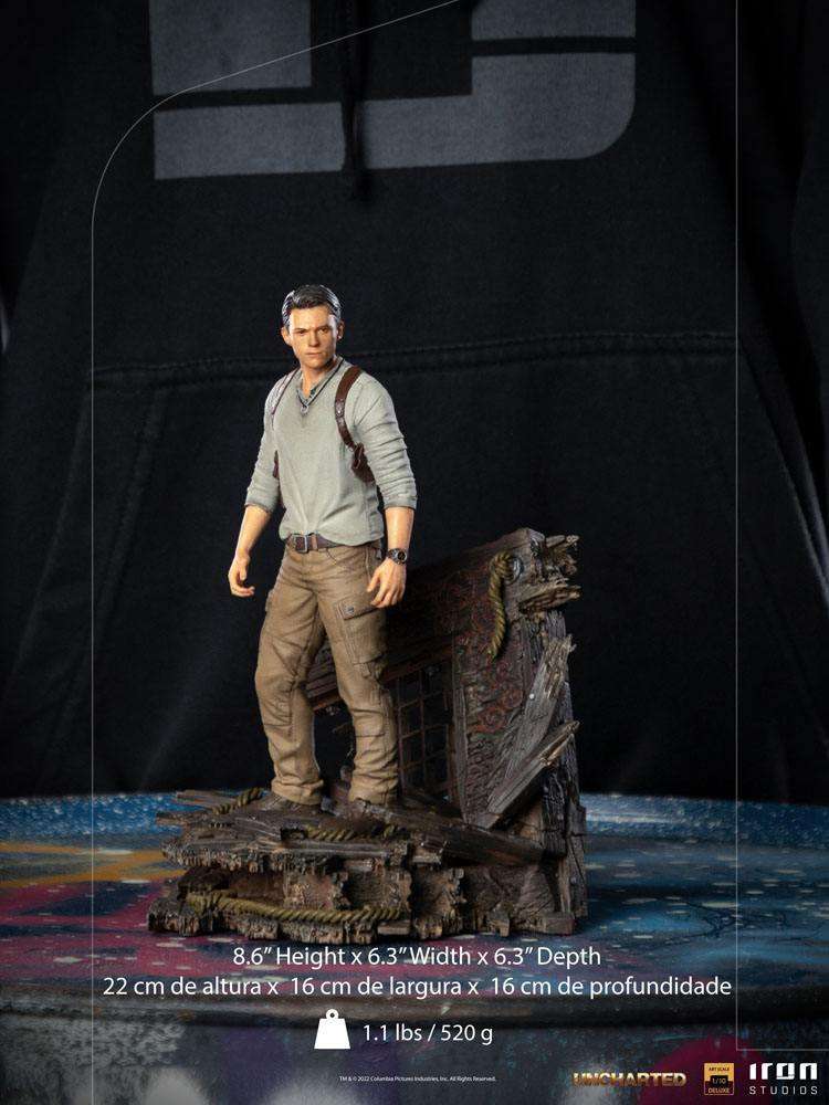 Iron Studios 1/10 Nathan Drake statue from the Uncharted movie, featuring a detailed figure on a shipwreck base.