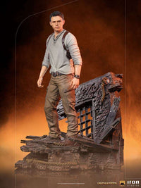 Iron Studios 1/10 Nathan Drake Uncharted movie statue standing on a detailed, weathered shipwreck base.