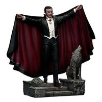 Iron Studios 1/10 Dracula statue featuring the vampire in a formal suit and red-lined cape with a wolf on a stone base.
