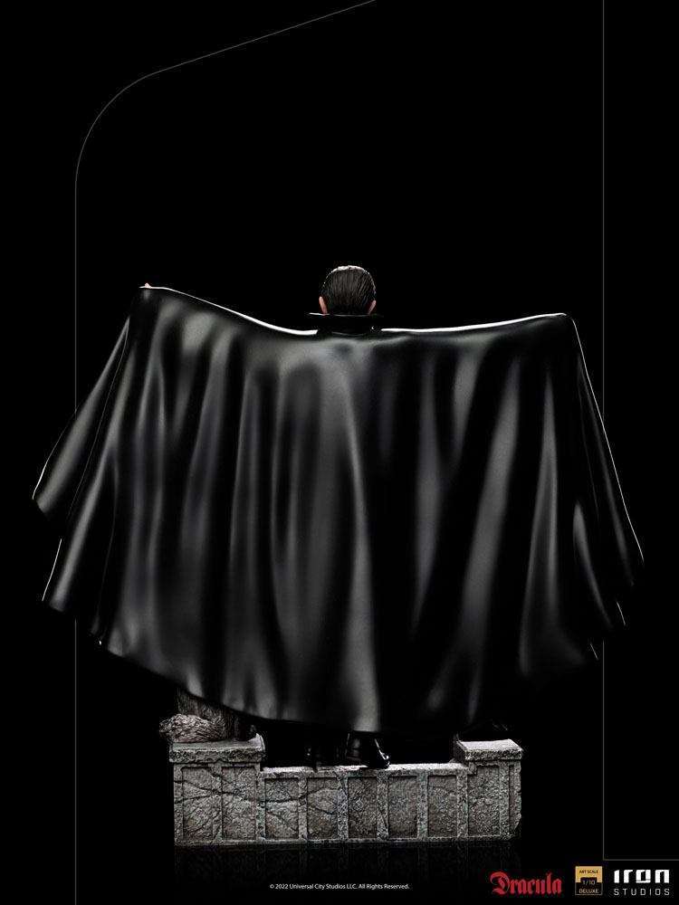 Back view of the 22 cm Iron Studios Dracula 1/10 scale statue, featuring a flowing black cape on a stone base.