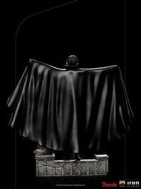 Back view of the 22 cm Iron Studios Dracula 1/10 scale statue, featuring a flowing black cape on a stone base.