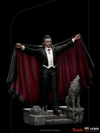 Iron Studios 1/10 Dracula Deluxe Art Scale statue showing the vampire in a black tuxedo with a red-lined cape and wolf.