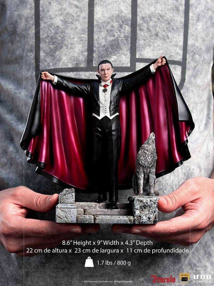 Front view of the 22 cm Iron Studios Dracula statue featuring a black cape with red lining and a wolf on a stone base.