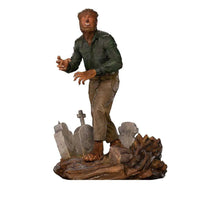 Iron Studios The Wolf Man 1/10 scale statue featuring the hairy monster in a green shirt standing on a graveyard base.