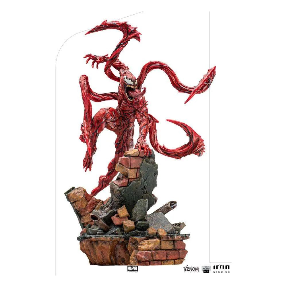 Iron Studios 1/10 Carnage statue from Venom: Let There Be Carnage, featuring a red, tendrilled figure on a brick base.
