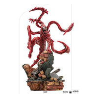 Iron Studios 1/10 Carnage statue from Venom: Let There Be Carnage, featuring a red, tendrilled figure on a brick base.