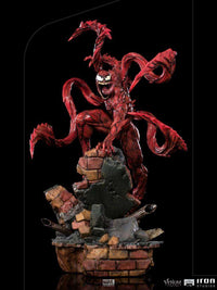 Iron Studios Carnage 1/10 scale statue featuring a red, textured symbiote figure on a detailed brick rubble base.