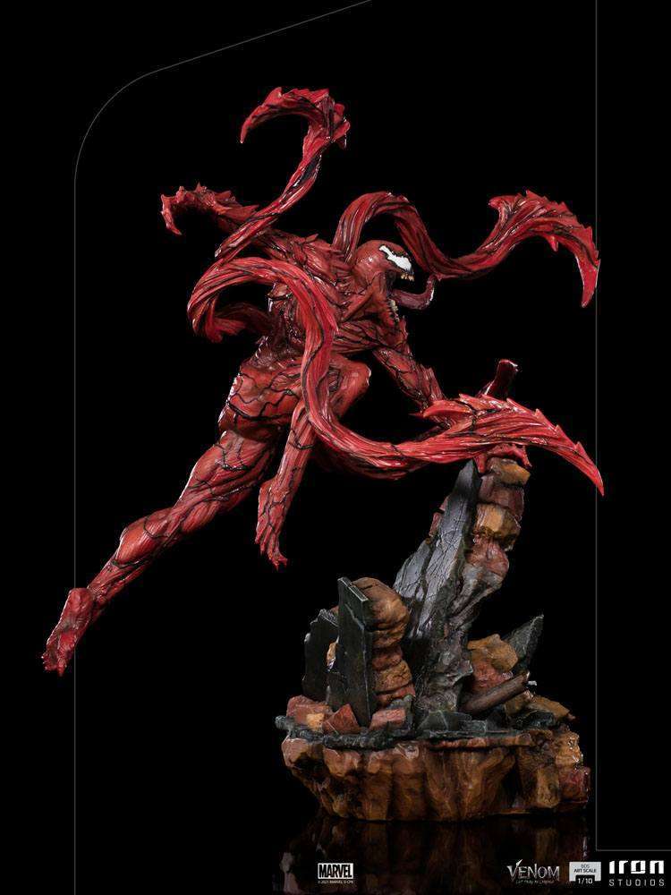 Iron Studios 1/10 Carnage statue from Venom: Let There Be Carnage, featuring a dynamic red symbiote pose on rubble base.