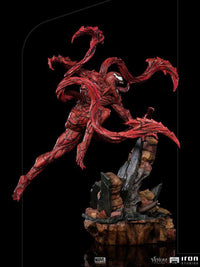 Iron Studios 1/10 Carnage statue from Venom: Let There Be Carnage, featuring a dynamic red symbiote pose on rubble base.
