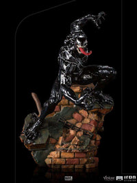 Iron Studios Venom 1/10 scale statue in a dynamic crouching pose on a detailed brick rubble base.