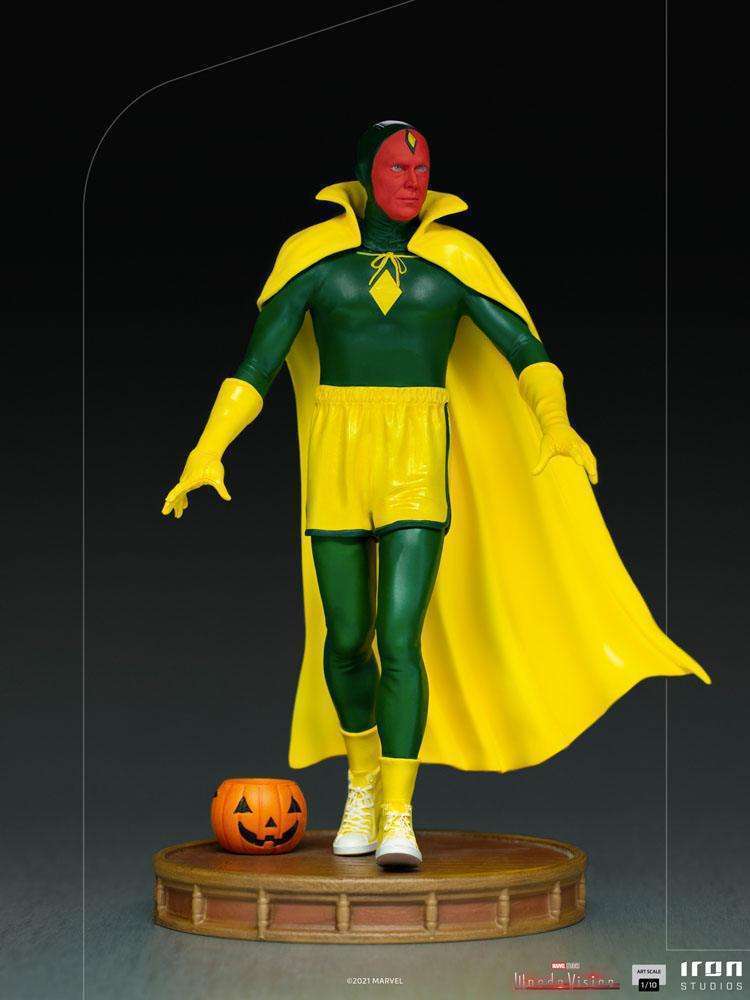 Iron Studios 1/10 Vision Halloween Version statue in a classic costume with a yellow cape and pumpkin on a base.