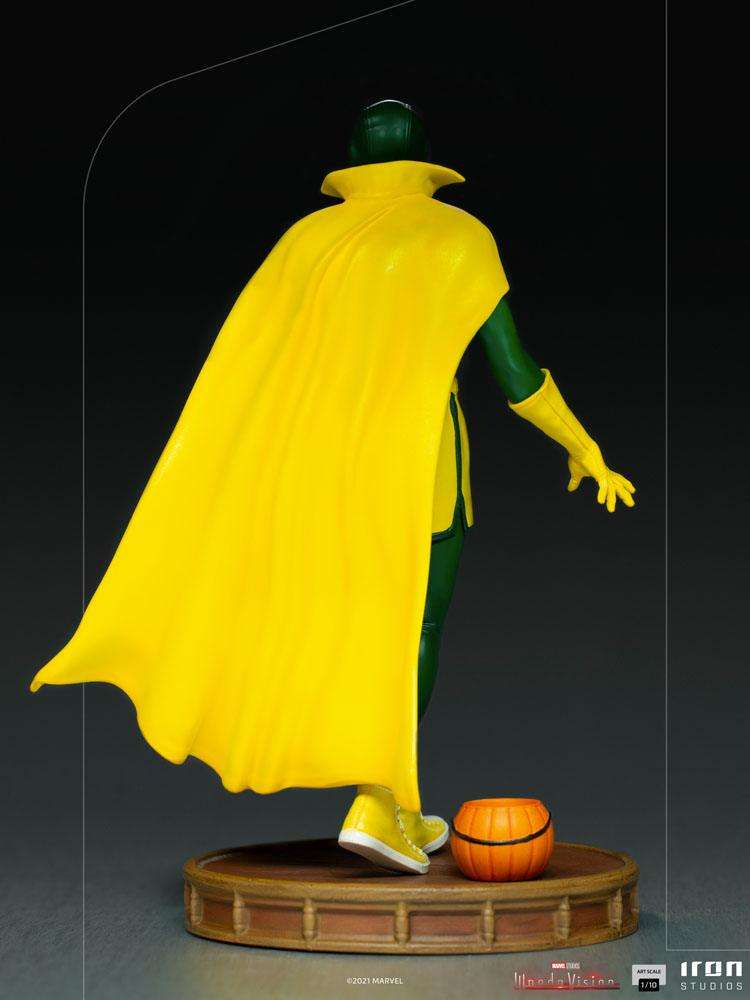 Back view of Iron Studios 1/10 Vision Halloween statue wearing a yellow cape and sneakers on a round display base.