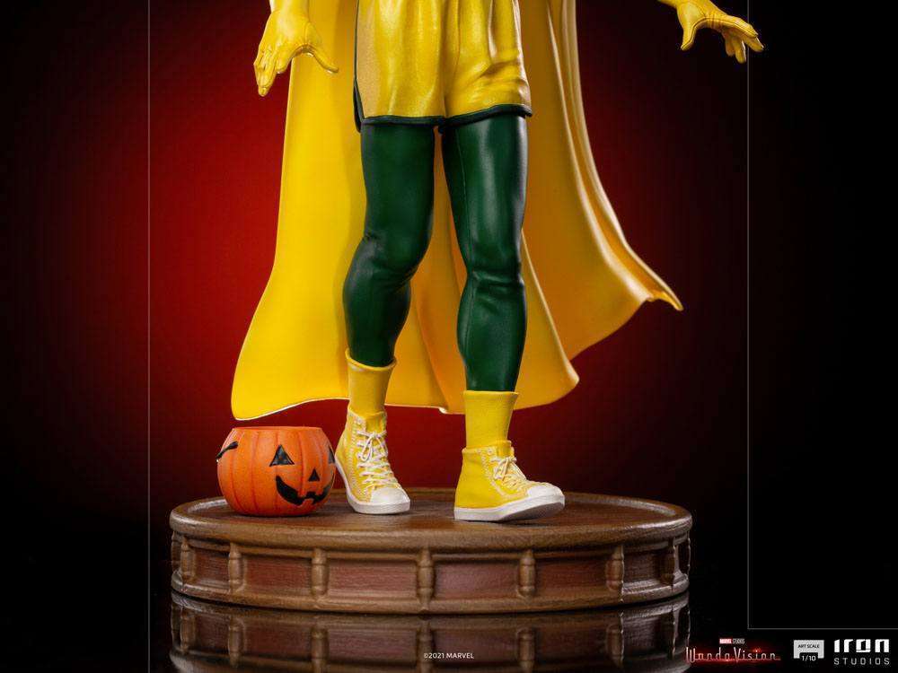 Iron Studios Vision Halloween Version 1/10 statue showing green leggings, yellow sneakers, and a pumpkin bucket on base.