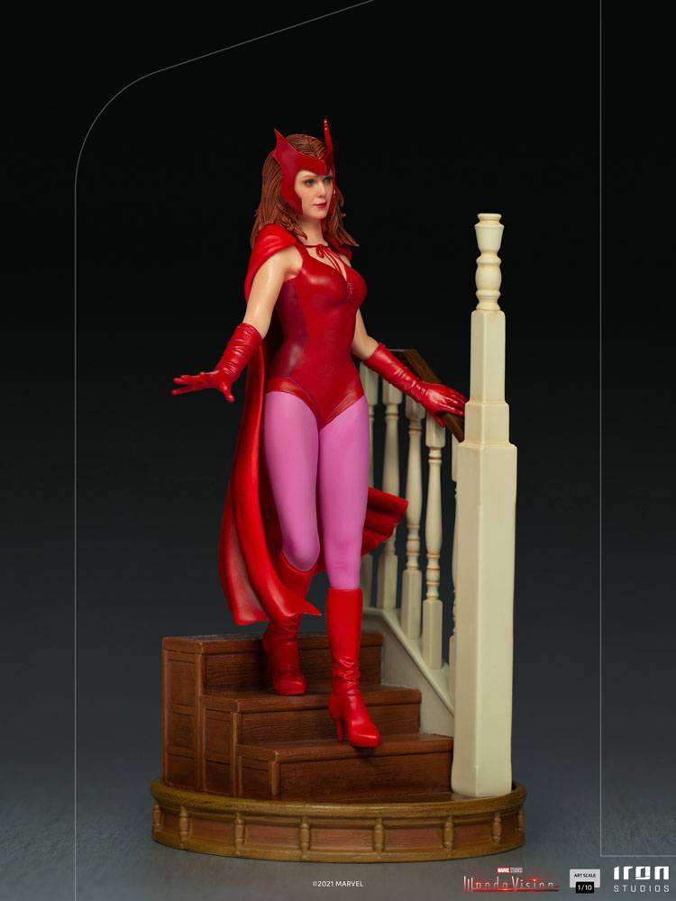 Iron Studios WandaVision 1/10 scale statue of Wanda in her red Halloween costume standing on a wooden staircase.
