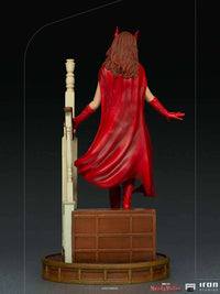 Back view of Iron Studios WandaVision 1/10 scale Wanda Halloween statue in a red cape standing on a wooden base.