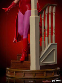 Iron Studios WandaVision 1/10 scale statue of Wanda in her red Halloween costume descending a wooden staircase.