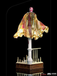 Back view of the 32 cm Iron Studios WandaVision Vision 1/10 scale statue with a flowing cape on a house-themed base.