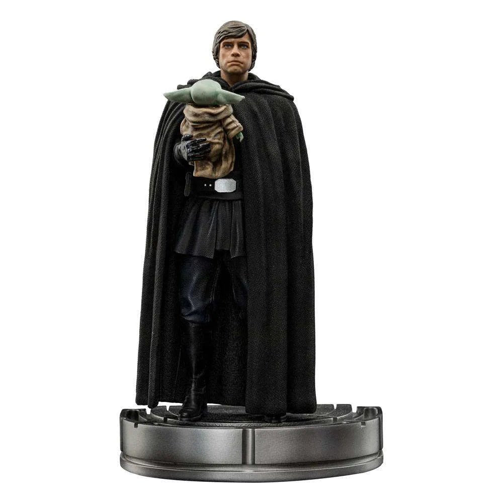Iron Studios 1/10 scale Luke Skywalker and Grogu statue in a black cloak, standing on a circular metallic base.