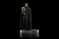 Iron Studios 1/10 scale Luke Skywalker and Grogu statue in a black cloak, standing on a circular display base.