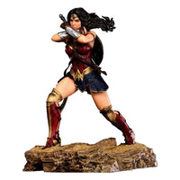 Iron Studios 1/10 Wonder Woman statue from Zack Snyder's Justice League in a dynamic battle pose on a rocky base.