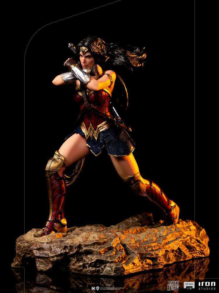 Iron Studios 1/10 Wonder Woman statue from Zack Snyder's Justice League in a dynamic combat pose on a rocky base.