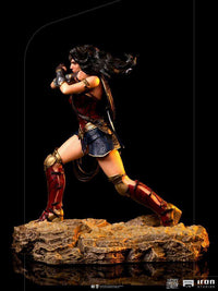 Side view of Iron Studios 1/10 Wonder Woman statue from Zack Snyder's Justice League in a dynamic combat pose.