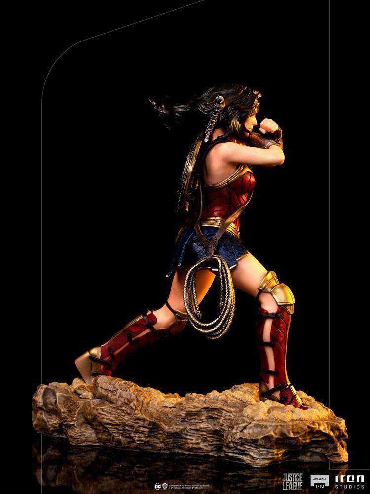 Side view of Iron Studios 1/10 Wonder Woman statue from Zack Snyder's Justice League in a dynamic combat pose.