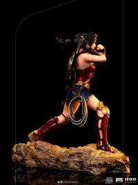 Side view of Iron Studios 1/10 Wonder Woman statue from Zack Snyder's Justice League in a dynamic combat pose.
