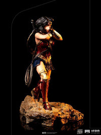 Iron Studios 1/10 Wonder Woman statue from Zack Snyder's Justice League in a dynamic side view on a rocky base.