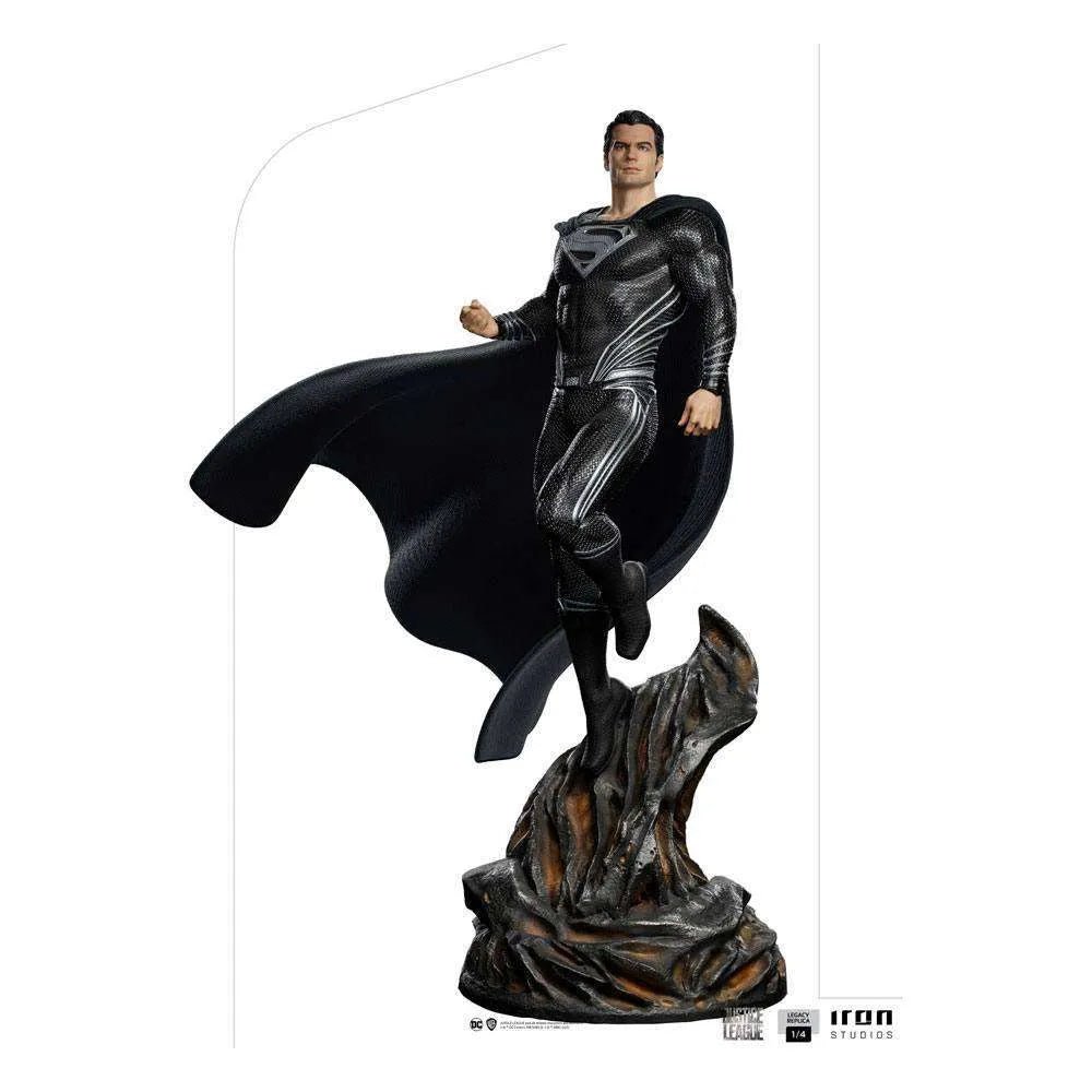 Iron Studios 1/4 scale Superman Black Suit statue from Justice League, featuring a flowing cape on a rocky base.