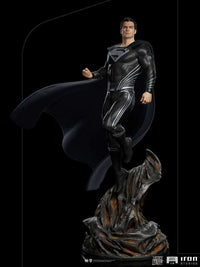 Iron Studios 1/4 scale Superman Black Suit statue from Justice League, featuring a detailed textured suit and cape.