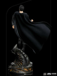 Back view of Iron Studios 1/4 scale Superman Black Suit statue from Zack Snyder's Justice League on a rocky base.