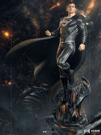 Iron Studios 1/4 scale Superman Black Suit statue from Justice League, featuring a textured suit and flowing cape.