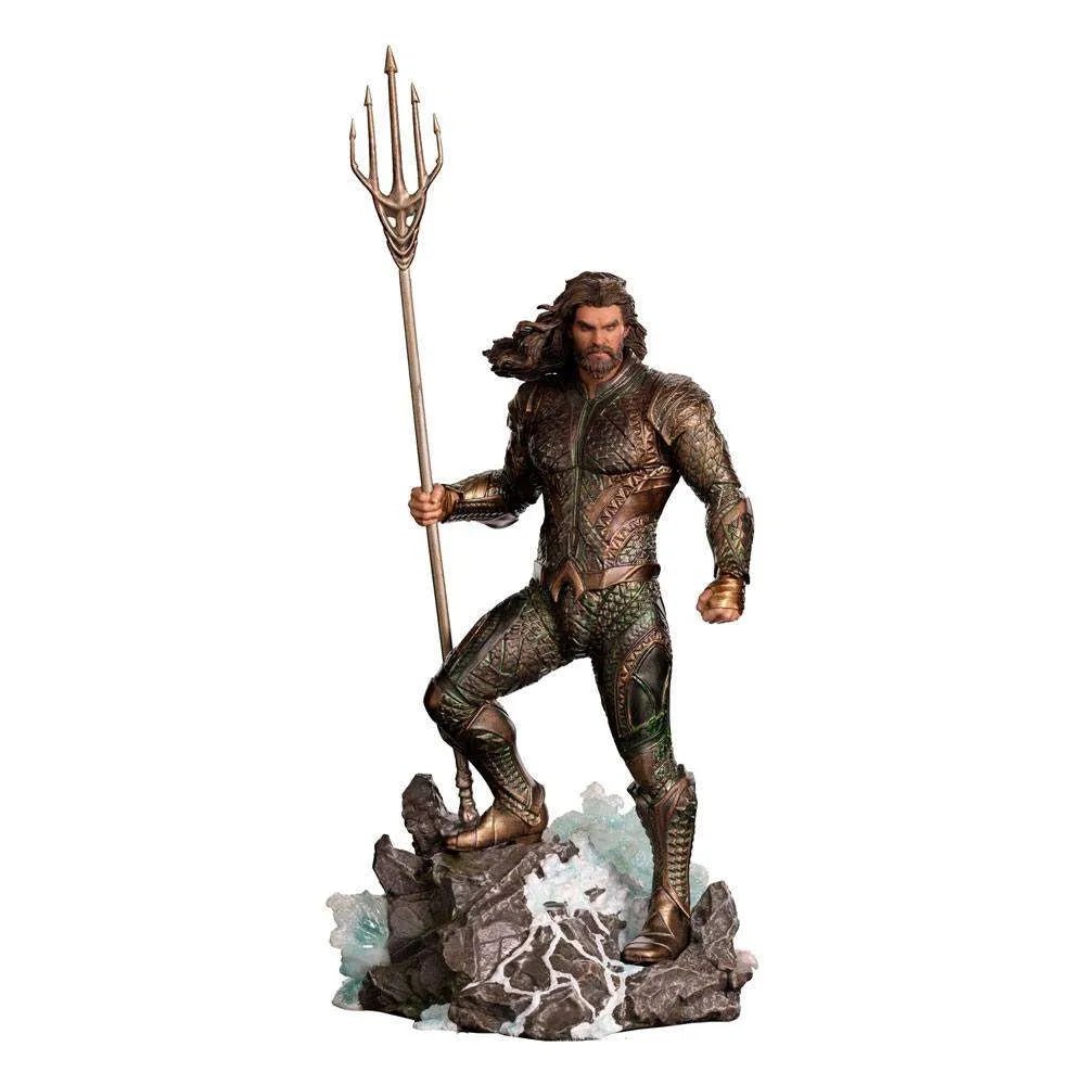 Iron Studios 1/10 Aquaman statue from Justice League, featuring a bronze-armored hero holding a trident on a rocky base.