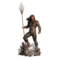 Iron Studios 1/10 Aquaman statue from Justice League, featuring a bronze-armored hero holding a trident on a rocky base.