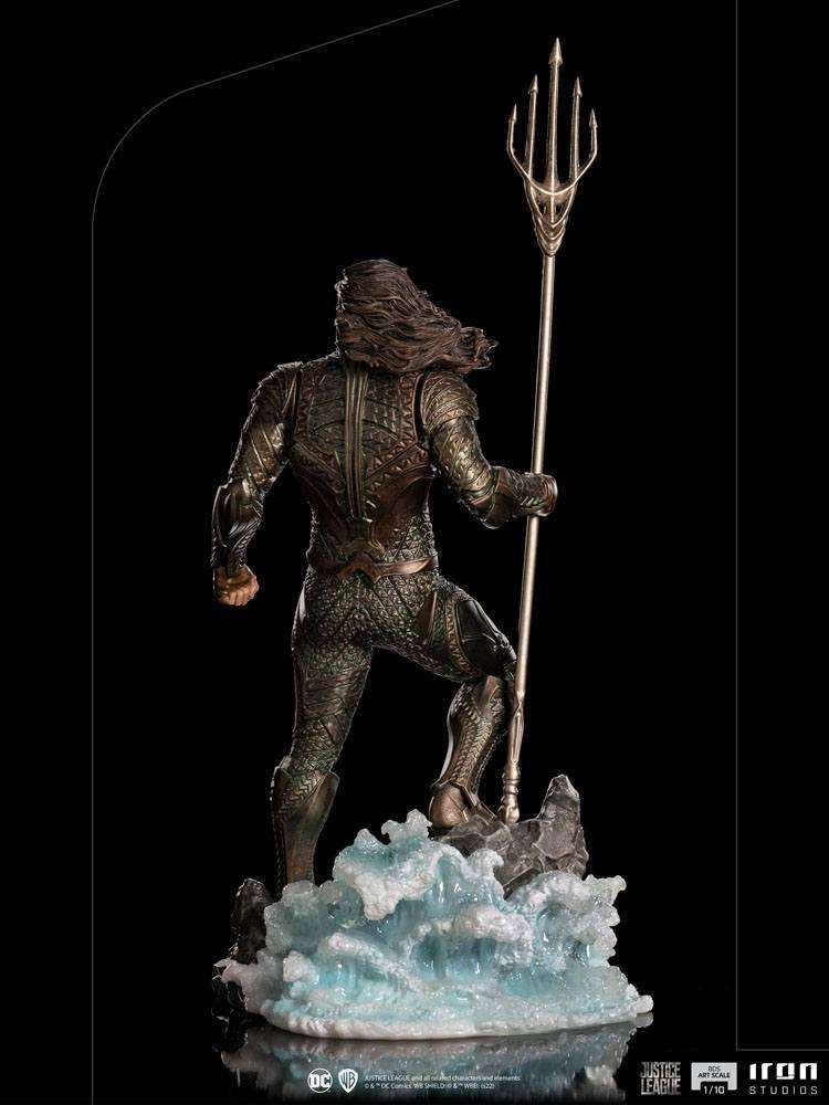 Back view of Iron Studios 1/10 scale Aquaman statue holding a trident, standing on a translucent water base.