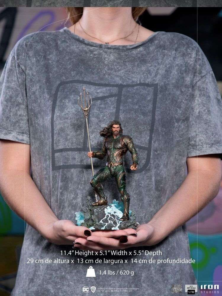 Iron Studios 1/10 scale Aquaman statue from Justice League, held in hands, featuring detailed armor and trident base.