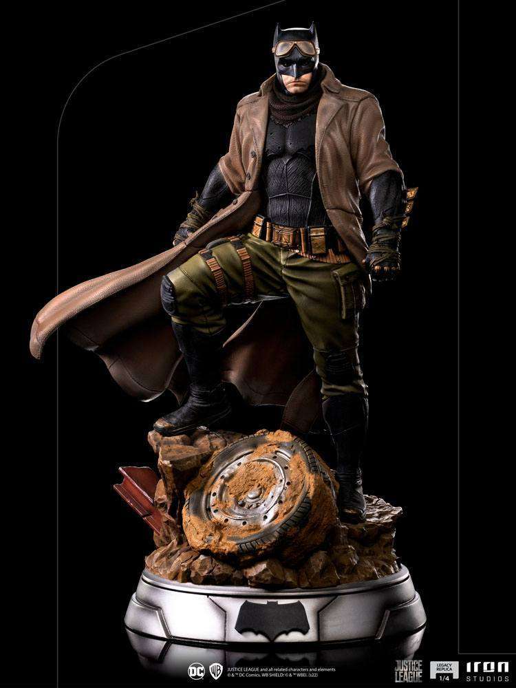 Iron Studios 1/4 scale Batman Knightmare statue from Justice League, featuring a trench coat and tactical gear base.