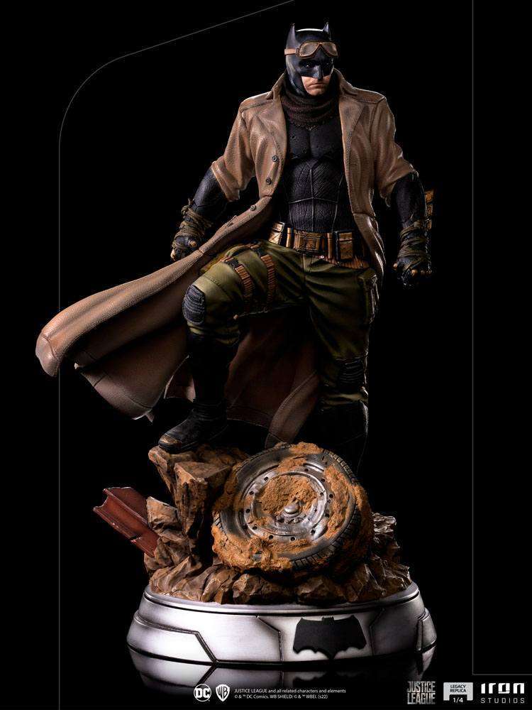 Iron Studios 1/4 Batman Knightmare statue from Justice League wearing a trench coat and goggles on a desert base.