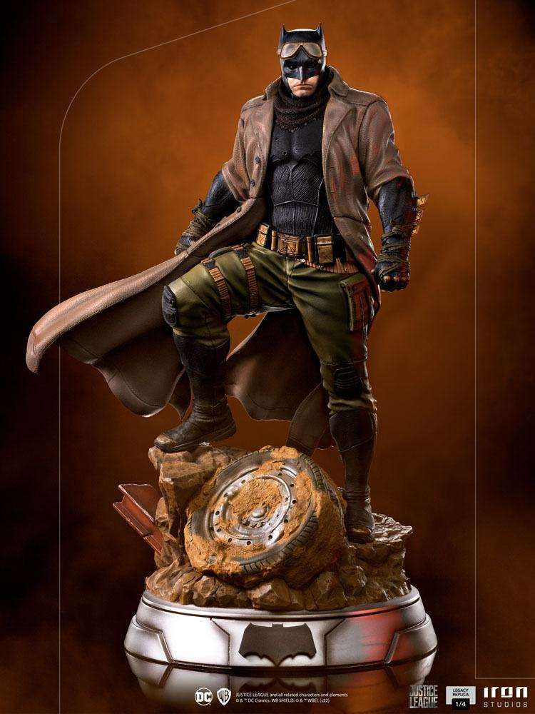 Iron Studios 1/4 scale Batman Knightmare statue in a trench coat and goggles, standing on a post-apocalyptic base.
