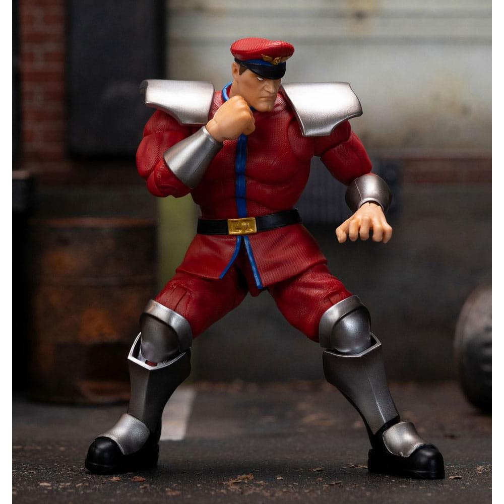 Jada Street Fighter M. Bison 1/12 scale action figure in a dynamic combat pose wearing his signature red military uniform.