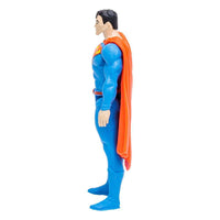 Side view of an 8 cm McFarlane DC Page Punchers Superman Rebirth figure in a blue suit with a flowing orange cape.