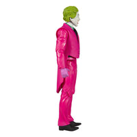 Side view of the 15 cm McFarlane DC Retro Batman 66 The Joker action figure in a bright pink suit and green hair.
