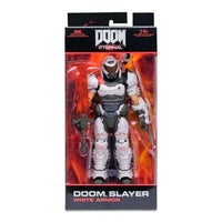 McFarlane Doom Eternal Doom Slayer action figure in white armor, displayed inside its original collector packaging.