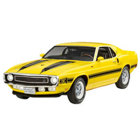 Bright yellow Revell '70 Shelby Mustang GT500 model kit with black racing stripes in a three-quarter front view.