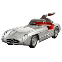 Silver Revell Mercedes-Benz 300 SLR 70th Anniversary model kit with gullwing doors open and red interior, front-side view.