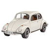Front three-quarter view of a white Revell 1:32 scale VW Beetle model kit with brown interior and chrome-rimmed wheels.